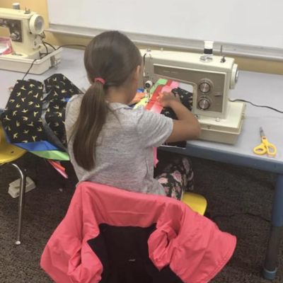 Student making a ribbon skirt